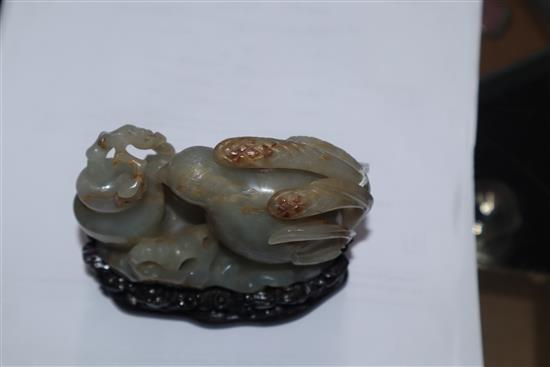 A Chinese pale celadon and russet jade quail carving, wood stand 10cm high including stand